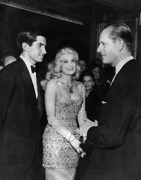 Prince Philip at the premier of the film The Victors meeting some of the stars of