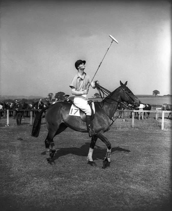 Framed Print : Prince Philip rides along on horseback holding a polo stick during a polo tournament Framed Print : Prince Philip rides along on horseback holding a polo stick during a polo tournament