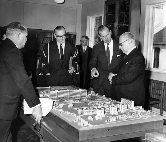 Framed Print : Prince Philip visiting Wales. The Duke of Edinburgh discusses a model of the new Teaching Framed Print : Prince Philip visiting Wales. The Duke of Edinburgh discusses a model of the new Teaching