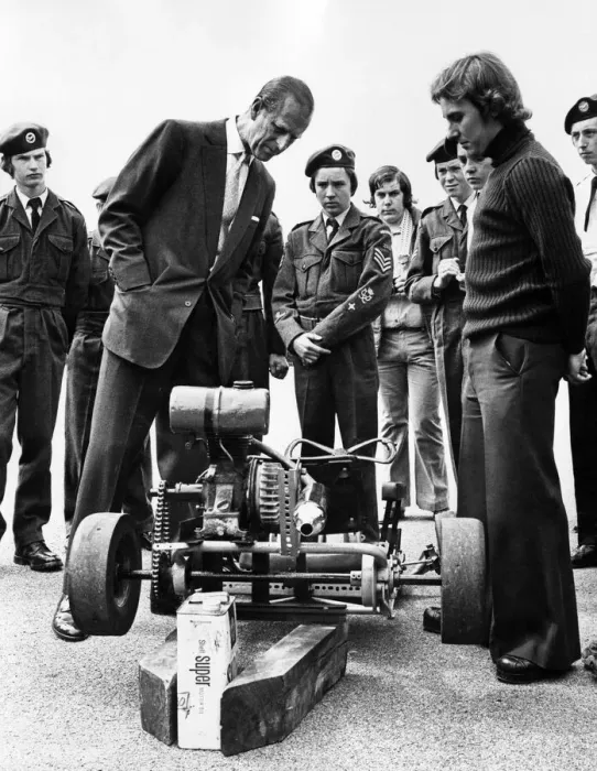 Framed Print : Prince Philip visiting Wales. The Duke of Edinburgh looks at a Go-cart made by members of Framed Print : Prince Philip visiting Wales. The Duke of Edinburgh looks at a Go-cart made by members of