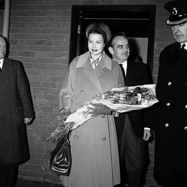 Prince Rainier III and Princess Grace of Monaco arriving in London to do some Christmas
