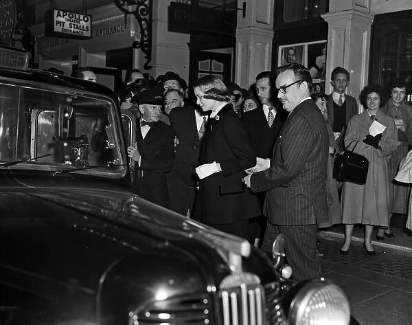 Prince Rainier and Princess Grace of Monaco leave the Apollo Theatre after watching '