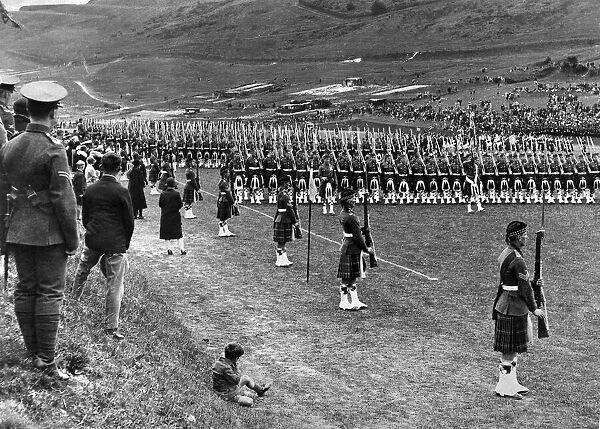 Prince of Wales inspects Seaforth Highlanders during a trooping of the colour ceremony at