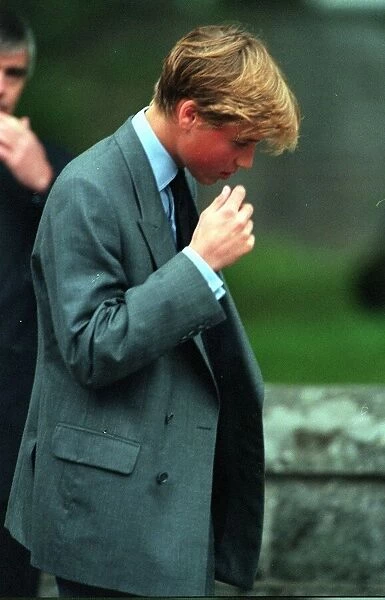Prince William brings a hand to his face, 4th September 1997
