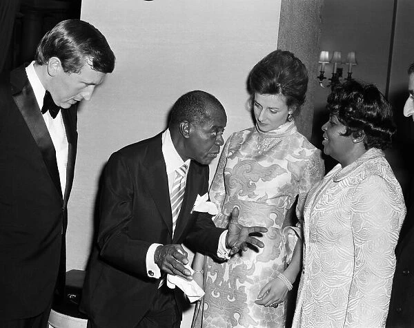 Princess Alexandra meets Louis Armstrong at a private party at the Savoy Hotel, London