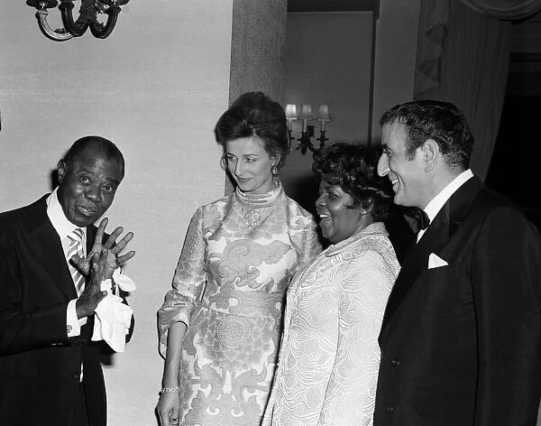 Princess Alexandra meets Louis Armstrong at a private party at the Savoy Hotel, London