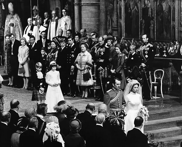 Princess Anne and Captain Mark Phillips walking down the aisle after their wedding