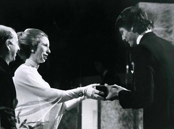 Princess Anne presents actor Christopher Reeve with the BAFTA award for the most