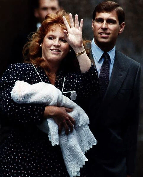 Princess Beatrice as a newborn baby in the arms of Duchess of York