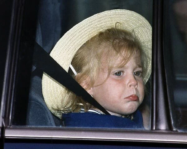 Princess Beatrice seated in car looking unhappy
