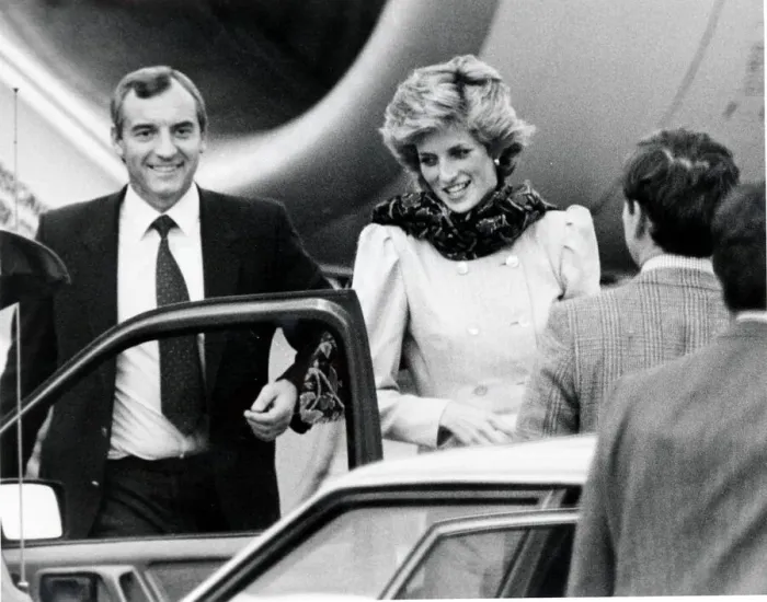 Framed Print : Princess Diana with her bodyguard at Aberdeen Airport as she interrupts her holiday in