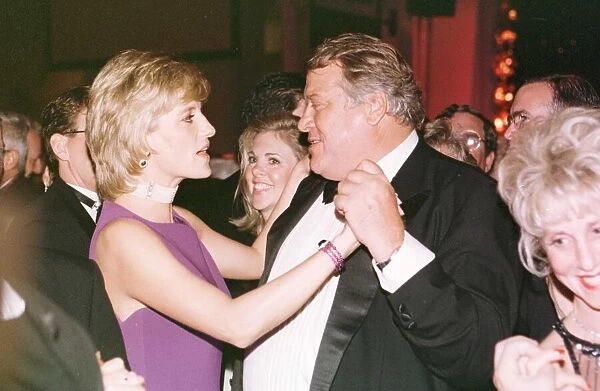 Princess Diana dances with American millionaire tool manufacturer Michael Wilkie at a