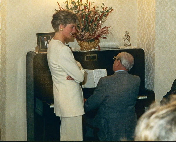 Princess Diana, HRH The Princess of Wales, sings along to the song '