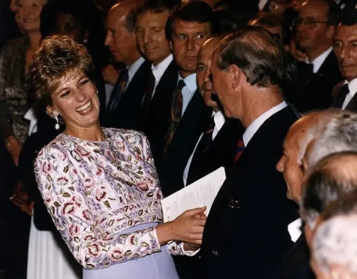  : Princess Diana laughing with Prince Charles after meeting members of England