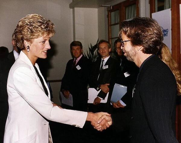 Princess Diana meets musician and singer Eric Clapton Rock at the charity film premiere
