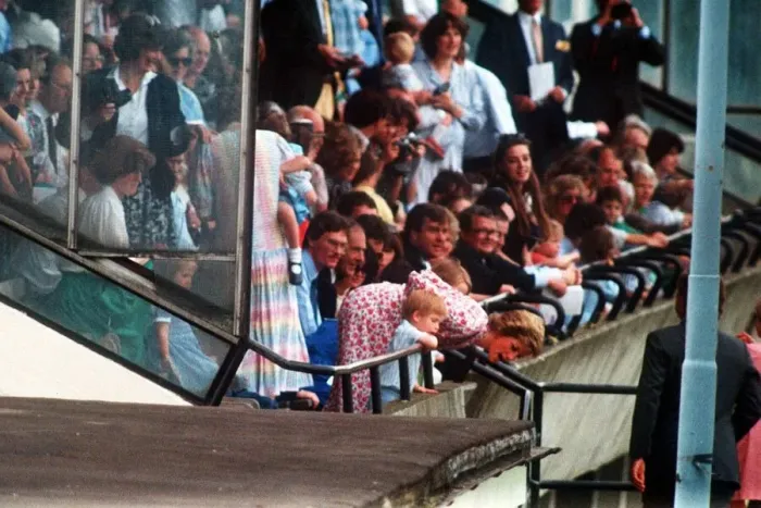 Framed Print : Princess Diana and Prince Harry lean over the railings to shout encouragement to Prince Framed Print : Princess Diana and Prince Harry lean over the railings to shout encouragement to Prince