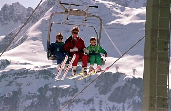 PRINCESS DIANA WITH PRINCE HARRY AND PRINCE WILLIAM, ON CHAIR LIFT WHILST ON SKIING