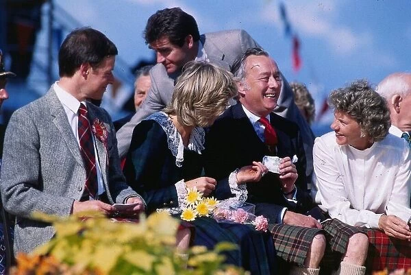 Princess Diana, Princess of Wales, handing over a pound note she found at Rothesay
