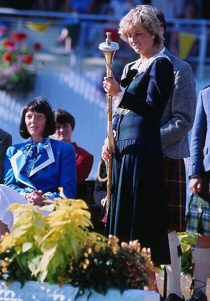 Princess Diana, Princess of Wales, holding the mace in her hand at the Rothesay Highland