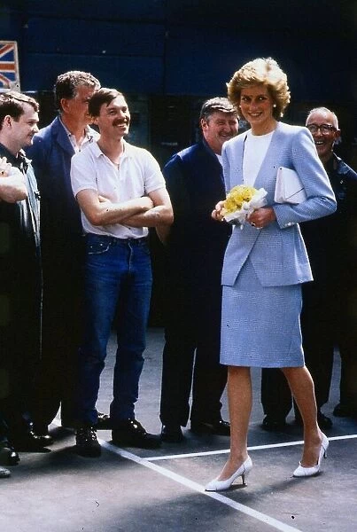 Princess Diana, Princess of Wales meets workers during a visit to the Walter Alexander