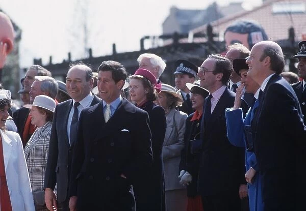 Princess Diana, Princess of Wales, wearing a blue coat, with husband Prince Charles