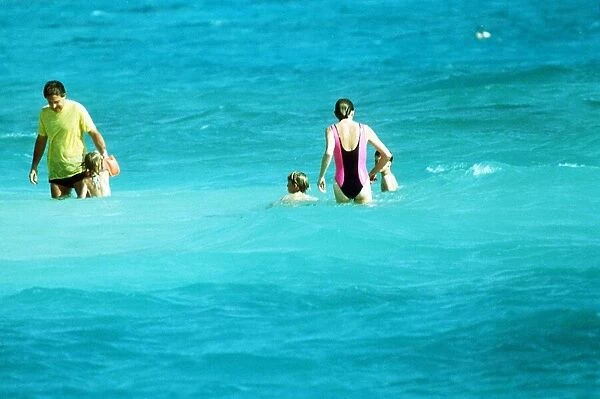 Princess Diana with her sons Prince William and Prince Harry take a swim in the sea with