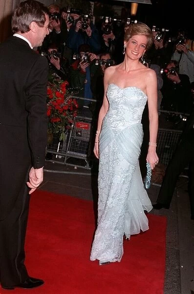 Princess Diana wearing an eggshell blue lace strapless evening dress designed by