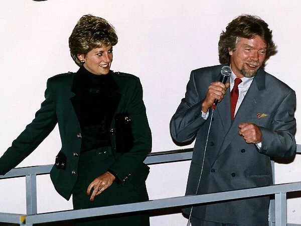 Princess Diana, wearing a green jacket and skirt suit, pictured at the naming ceremony of