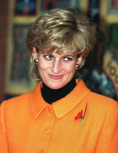 Princess Diana, wearing oragne jacket, poppy and black jumper visits Liverpools Womens