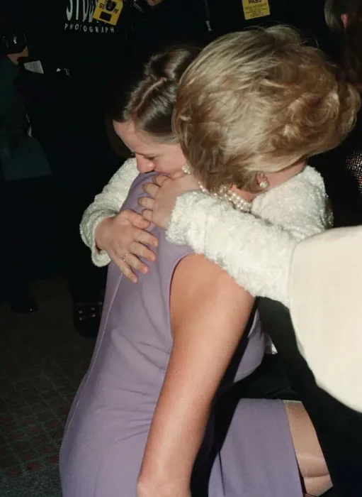 Framed Print : Princess Diana, wearing a purple dress, hugs Emma Jones at a Commonwealth Day luncheon in Framed Print : Princess Diana, wearing a purple dress, hugs Emma Jones at a Commonwealth Day luncheon in