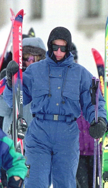 Princess Diana wearing ski-ing outfit and balaclava and sunglasses during a ski-ing
