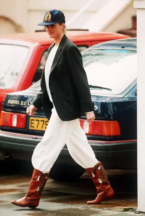 Framed Print : Princess Diana wearing an unusual combination of white trousers, boots Framed Print : Princess Diana wearing an unusual combination of white trousers, boots