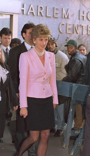 Princess Diana wears pink jacket and black skirt during a visit to Harlem