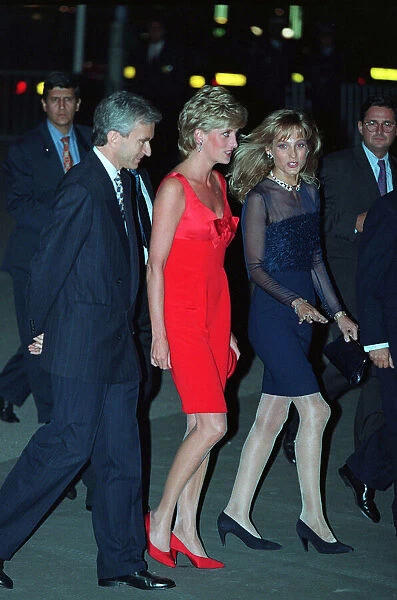 Princess Diana wears a red evening dress with red shoes