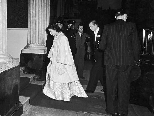Princess Elizabeth and the Duke of Edinburgh arriving at the French Embassy