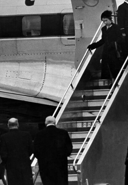 Princess Elizabeth steps from her plane after landing at London Airport after being