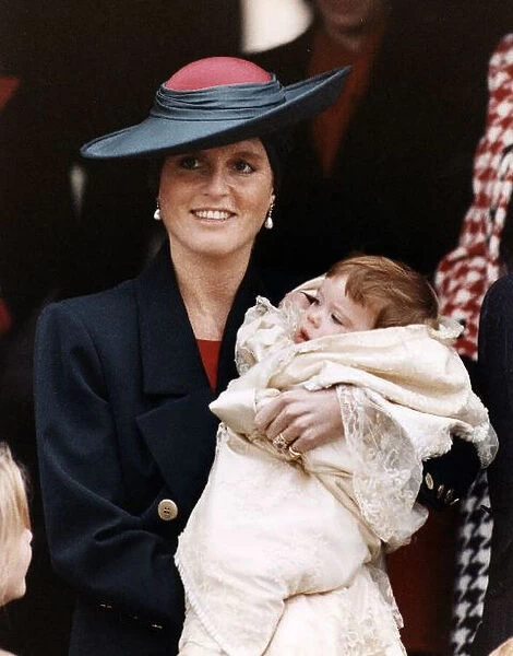 Princess Eugenie being held by her Mother Duchess Of York