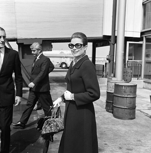 Princess Grace of Monaco and her husband Prince Rainier fly in to London Heathrow Airport