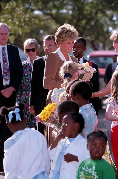 PRINCESS OF WALES GREETING PEOPLE DURING A VISIT TO CHARITY PROJECTS IN ZIMBABWE - JULY