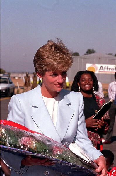 PRINCESS OF WALES HOLDING FLOWERS DURING A VISIT TO RED CROSS CHARITY PROJECT IN ZIMBABWE