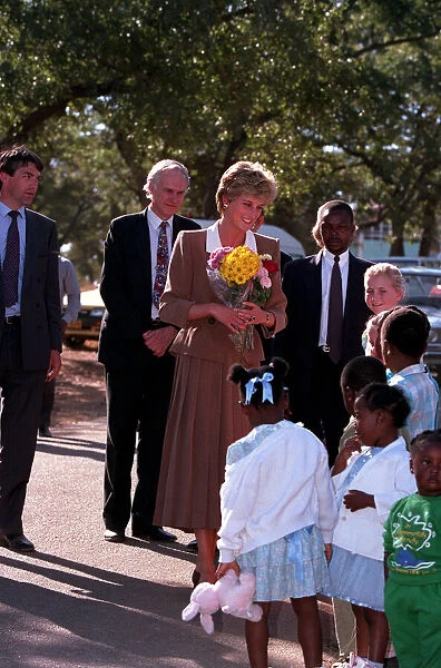 PRINCESS OF WALES MEETING CHILDREN DURING A VISIT TO CHARITY PROJECTS IN ZIMBABWE - JULY