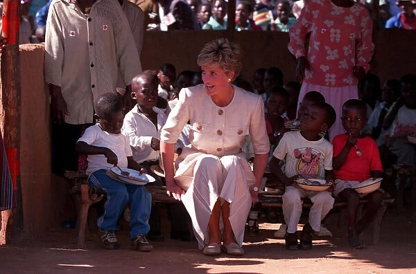 PRINCESS OF WALES SITTING WITH CHILDREN DURING VISIT TO RED CROSS CHARITY PROJECT IN