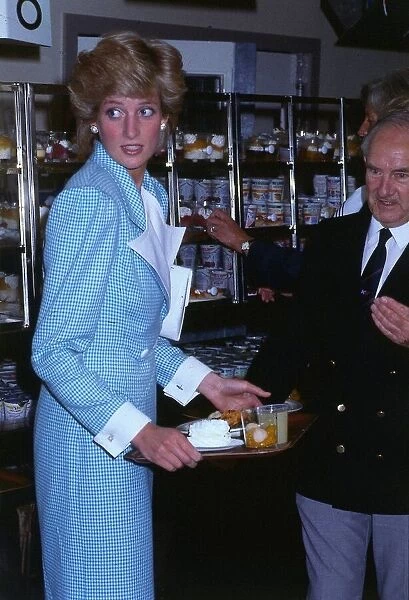 Princesss Diana Princess of Wales, holding a tray of food at the Commonwealth games