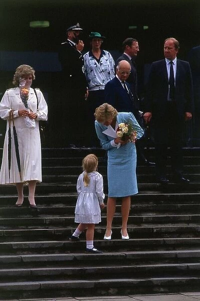 Princesss Diana, Princess of Wales talking to little girl Claire Greoger after she was