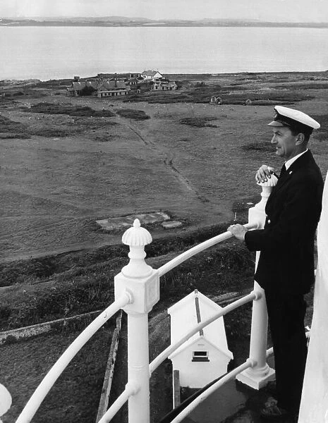 Principal Keeper Colin Nicholls admires the view from the top of the Flat Holm Lighthouse