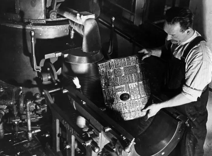 Framed Print : Printers Circa 1950 Printer places a hot metal plate on a printing press Framed Print : Printers Circa 1950 Printer places a hot metal plate on a printing press