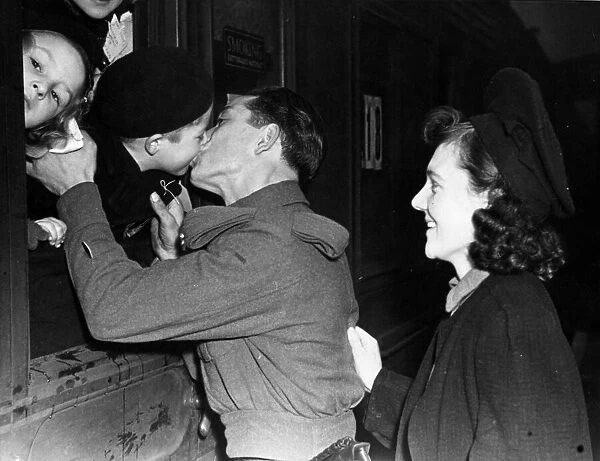 Private Amerelli says goodbye to his son, aged five, he is off to fight and mother