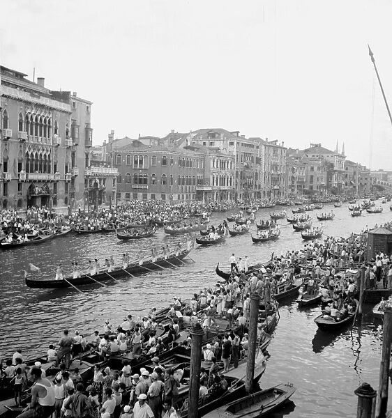 A procession of the gondolas pass along the Grand Canal after the race of the nine