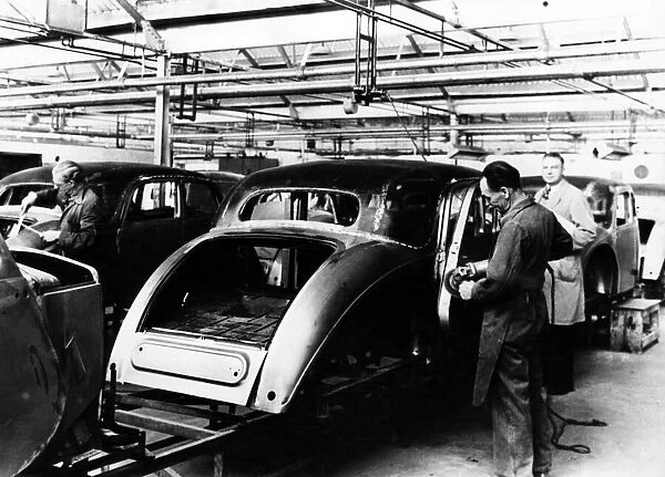 Production of Riley saloons in the late 1940s. Skilled tradesmen are seen fettling
