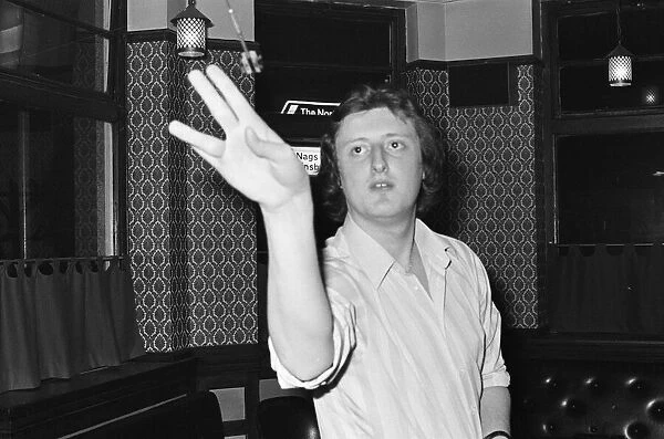 Professional British dart player Eric Bristow in action at the General Picton Public